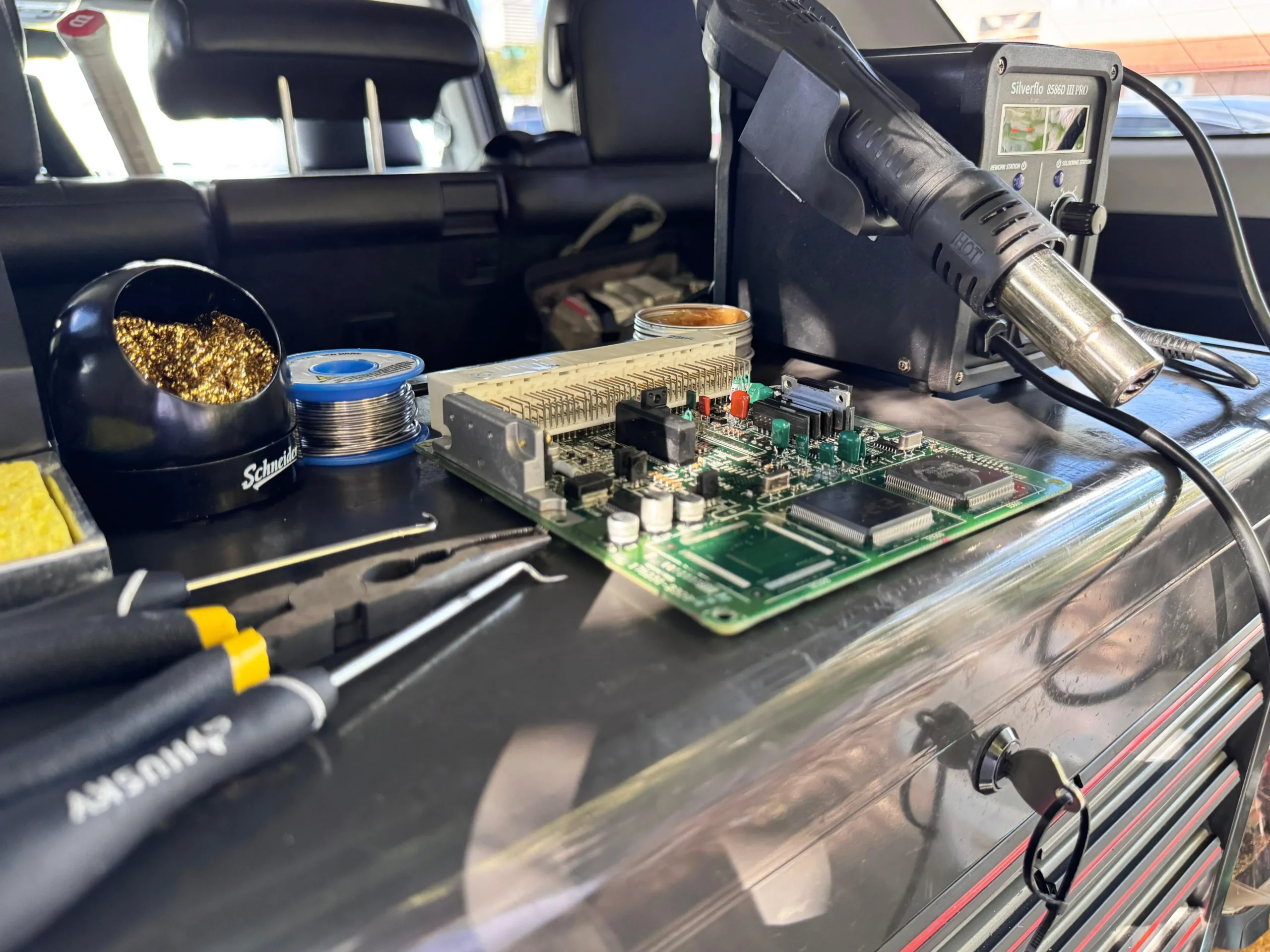 Automotive circuit board repair in shop bench