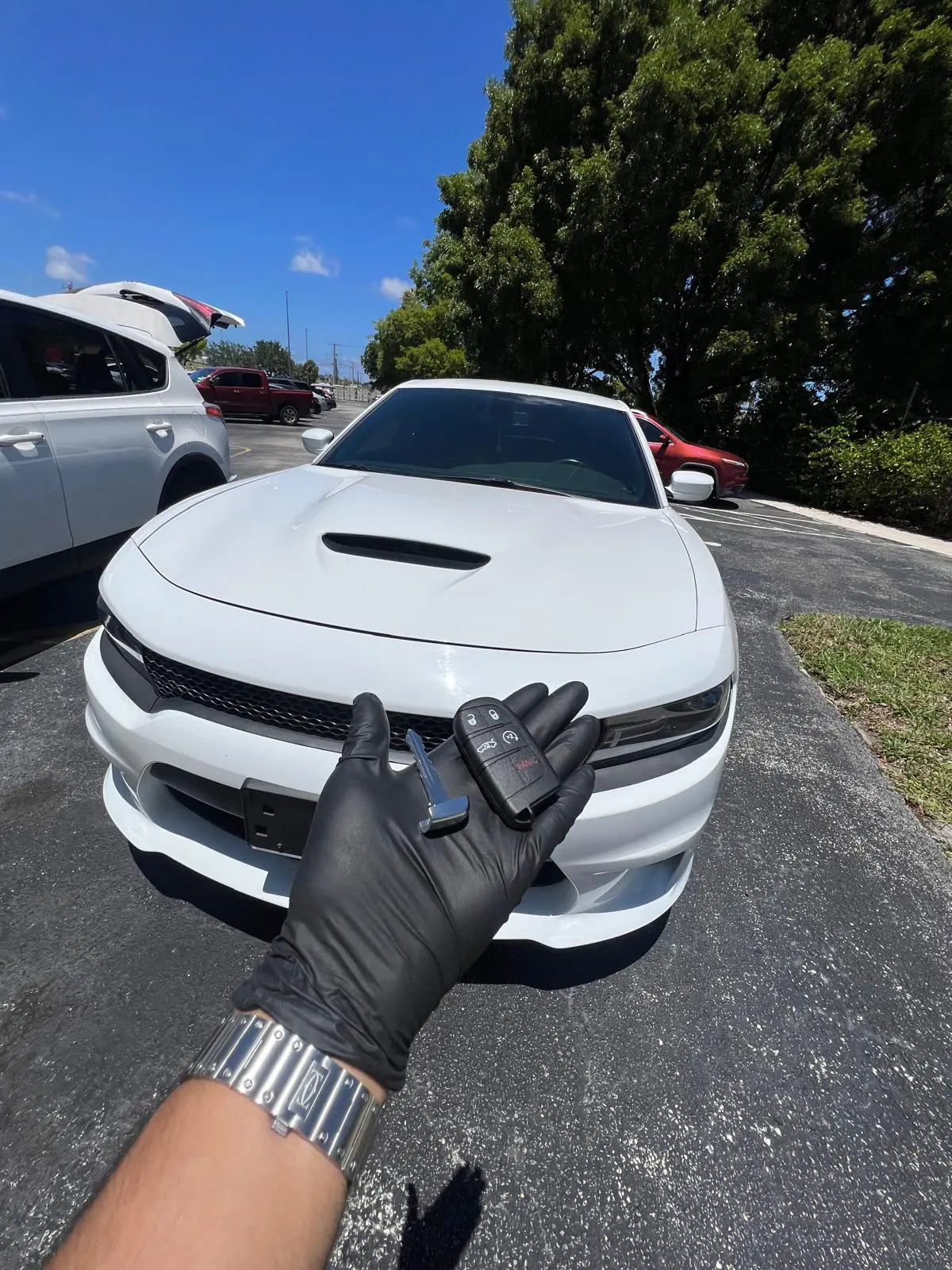 Locksmith holding a new Dodge Charger key