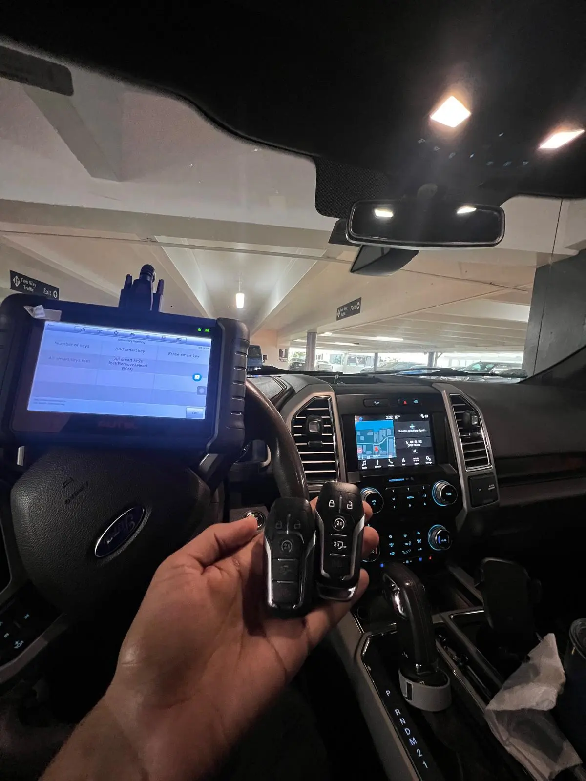 Two smart keys cut for an F-150 in a parking garage